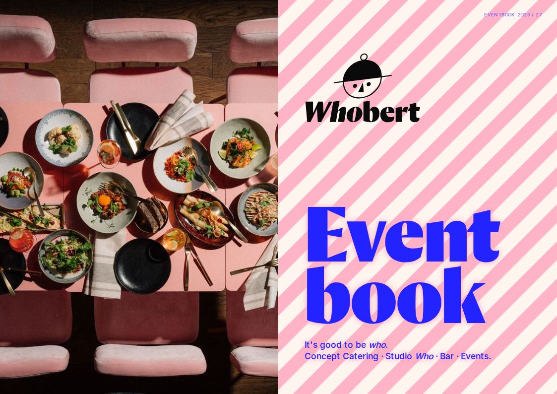 Cover des Whobert Eventbooks 2026/27: Blick von oben auf die rosa Tafel, daneben der Titel auf rosa-cremefarbenen Streifen